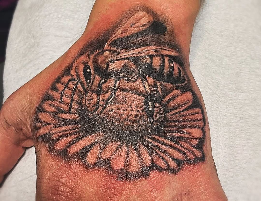 Tattoo done by James available in our Belleville location, for any inquiries or to book a consultation call him at 613-779-8129 or stop by the shop 180 North Front Street Belleville or email wildinkbelleville@gmail.com #tattoo #tattoos #tattooed #tattooshop #tattooartist #ink #inked #inkedtattoo #wildink #wildinkstudios #wildinkbelleville #bee #beetattoo #honeybee #flower #flowertattoo #handtattoo #insect #insecttattoo #blackandgreytattoo #belleville #ontario #canada #bellevilletattoos