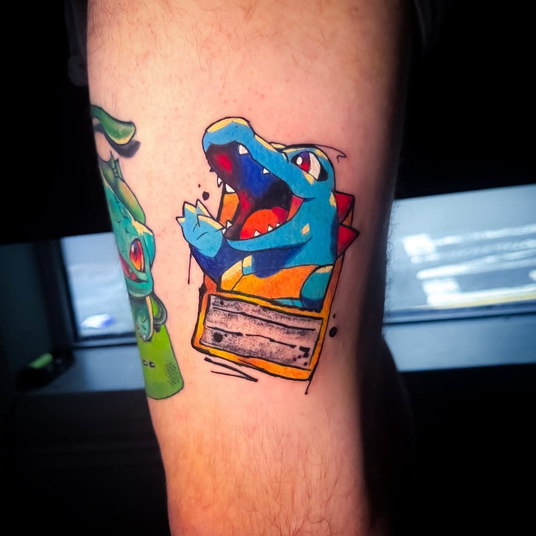 Totodile Pokémon card for Bevan today.
A pleasure as always dude 😁😁.

Have a few others booked in and would love to do more.
DM to enquire 
 #tattooartist #pokemonart 
#pokemon #totadiletattoo #totadile 
#inkedlife #tattooartist
#tattoooftheday #tattoosofinstagram #instagood #thebesttattooartists  #tattooed #tattooart #inklife #tattoo #tattoocommunity  #art #tattooartwork #uktattooartists