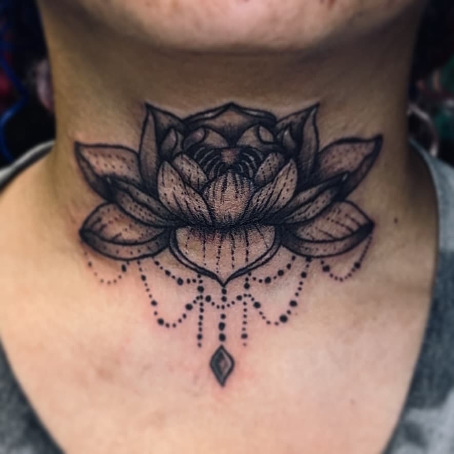 Gorgeous tattoo by our apprentice @crassindas.ink. She’s booked quite a bit of March already, so reach out *soon* to get on the schedule 
•
•
•
•
•
•
•
•
#throattattoo #floraltattoo #lotustattoo #tattooapprentice #nctattooartist