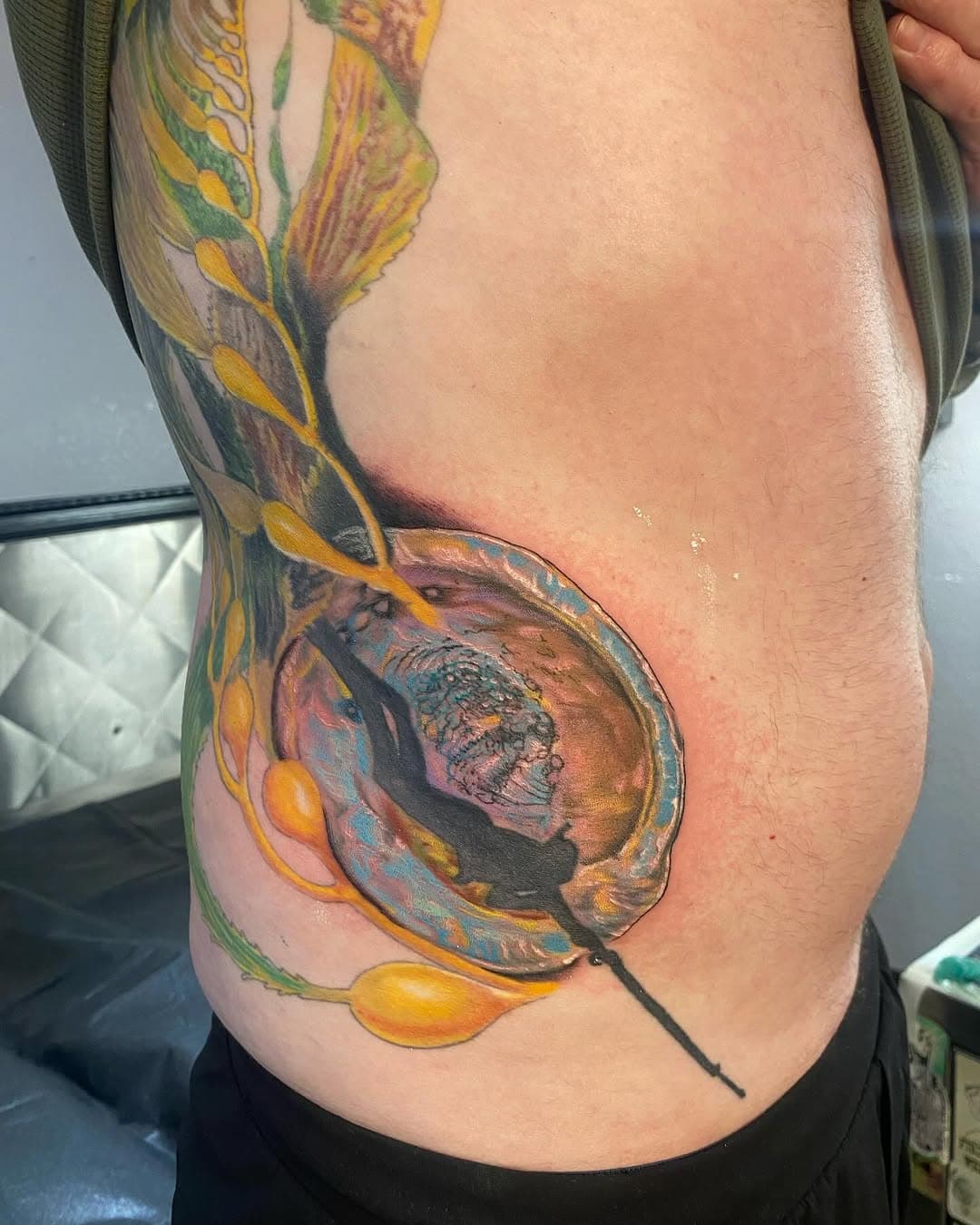 I added an abalone shell to this kelp tattoo.what a fun color exercise. Work in progress, more to come!