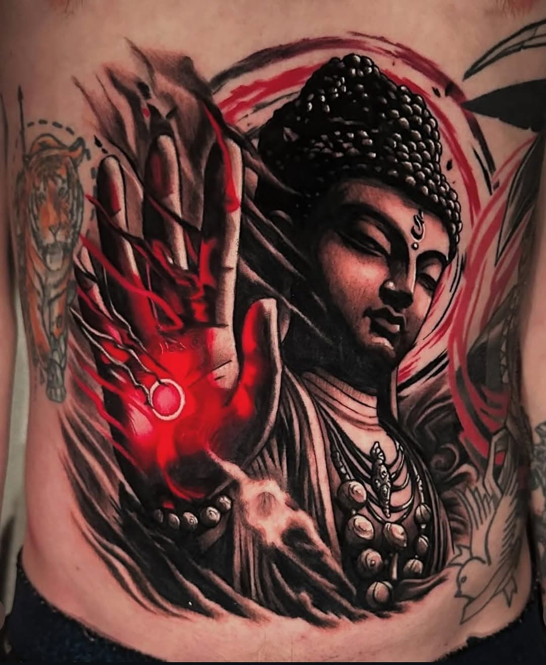 INSANE stomach piece by @bronbronink! Great use of black and red with all those little details #tattoo #nj #newjersey  #njtattooartist #customtattoo #newfoundlandnj #tattoo #okamitattoo #buddah #buddahtattoo #stomachtattoo