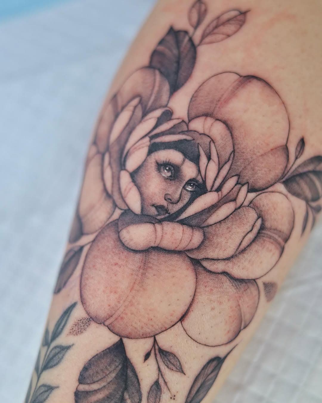 Peony with a hidden portrait 
Original art tattooed
It is always a treat todo such project, I feel spoiled sometimes when clients trust my vision.

————
Tattoo and design by yours truly @tattoo.faisal 
Done @enkitattoogallery 
———-
#michigantattooartist #michigantattoos #tattooshop #tattooartist #tattooist #art #floraltattoos #tattoostyle #michigan #michiganders #inked #blackandgreytattoos #finelinetattoo #finelinetattooartist #tattoostyle #tattooworld #detroittattooartist #detroittattoos #flowertattoo #peonytattoo