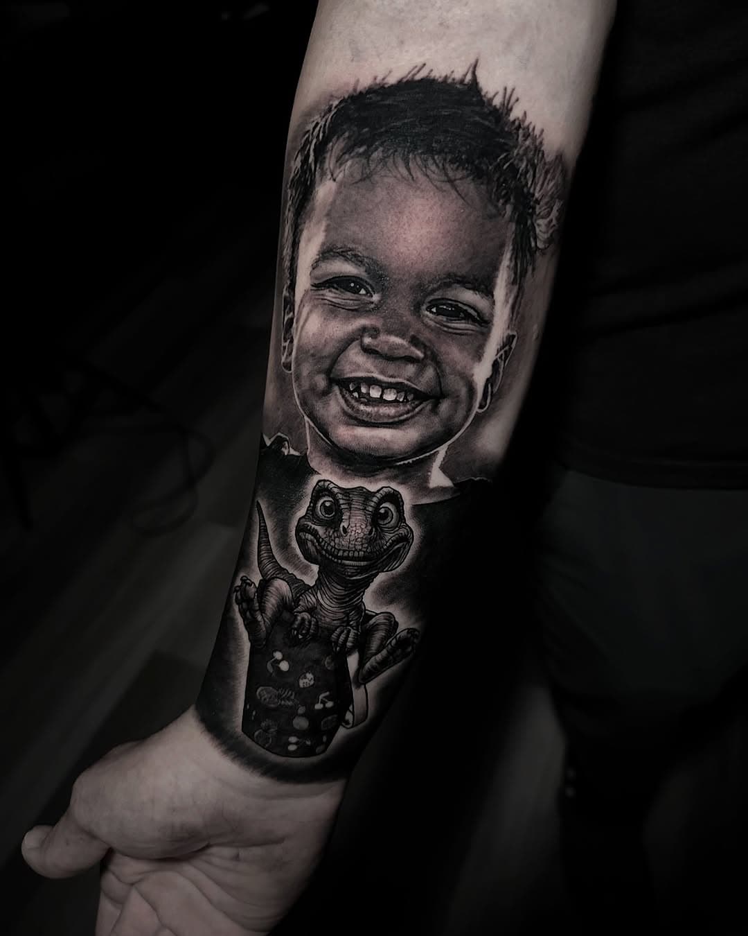 Got to tattoo BJs little boy on him last week, we added the dinosaur sitting in the bucket because his son loves dinosaurs and cannot leave that bucket alone 🤣🤣 
What would you get added to a portrait of your loved one ? 

To book an appointment please email inquiries@stevebutchertattoos.com or send me a DM 

Done using @inkmachines @intenzetattooink @h2oceanproteam @kwadron @tattooarmour_usa @mdwipeoutz @gorillaglove 

#tattoo #tattooart #realism #art #realismtattoo #realistictattoo #portraittattoo #explore #realistictattoos