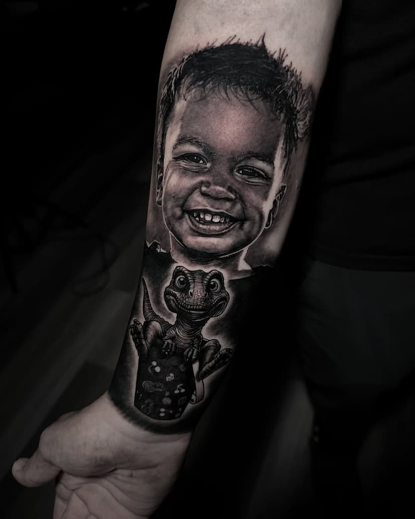 Got to tattoo BJs little boy on him last week, we added the dinosaur sitting in the bucket because his son loves dinosaurs and cannot leave that bucket alone 🤣🤣 
What would you get added to a portrait of your loved one ? 

To book an appointment please email inquiries@stevebutchertattoos.com or send me a DM 

Done using @inkmachines @intenzetattooink @h2oceanproteam @kwadron @tattooarmour_usa @mdwipeoutz @gorillaglove 

#tattoo #tattooart #realism #art #realismtattoo #realistictattoo #portraittattoo #explore #realistictattoos