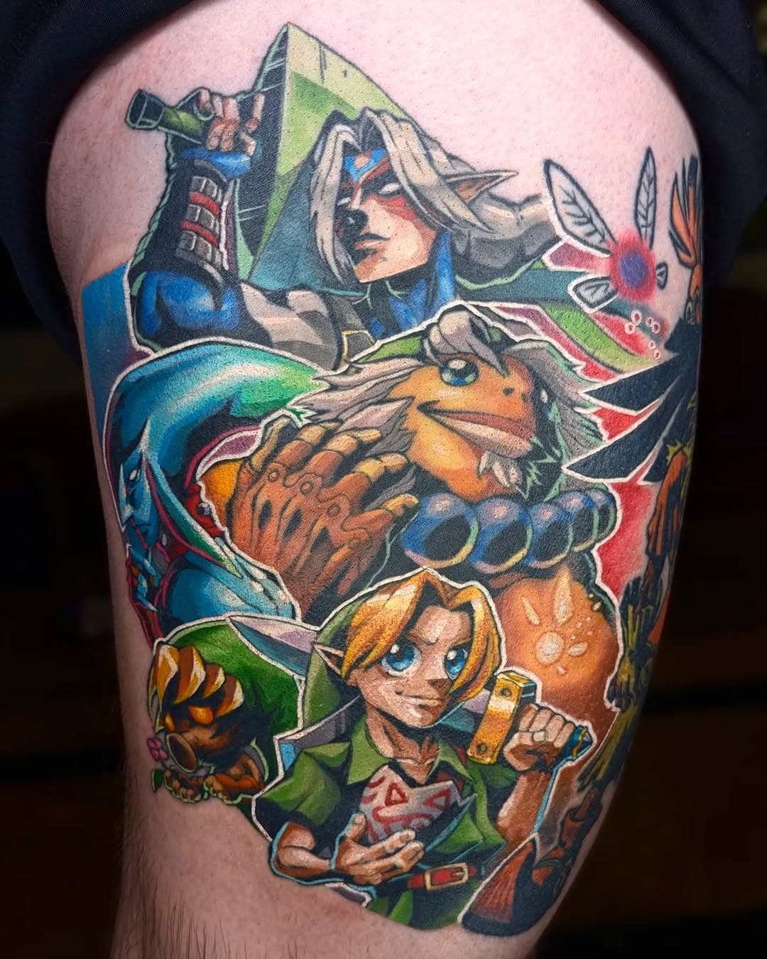 Majora's Mask add-on for Vincent! Thank you for a great project, it was really fun adding on to the Skull Kid (not done by me, really well done tattoo). Three sessions, one for lines + black shading, 2 for color rendering. Deku Link, Zora Link, and part of Young Link + the white outlines and background colors are fresh, the rest is healed.

#majorasmask #zelda #phillytattooartist #nerdytattoo #fanarttattoo #customtattoo #lordlexantattoos