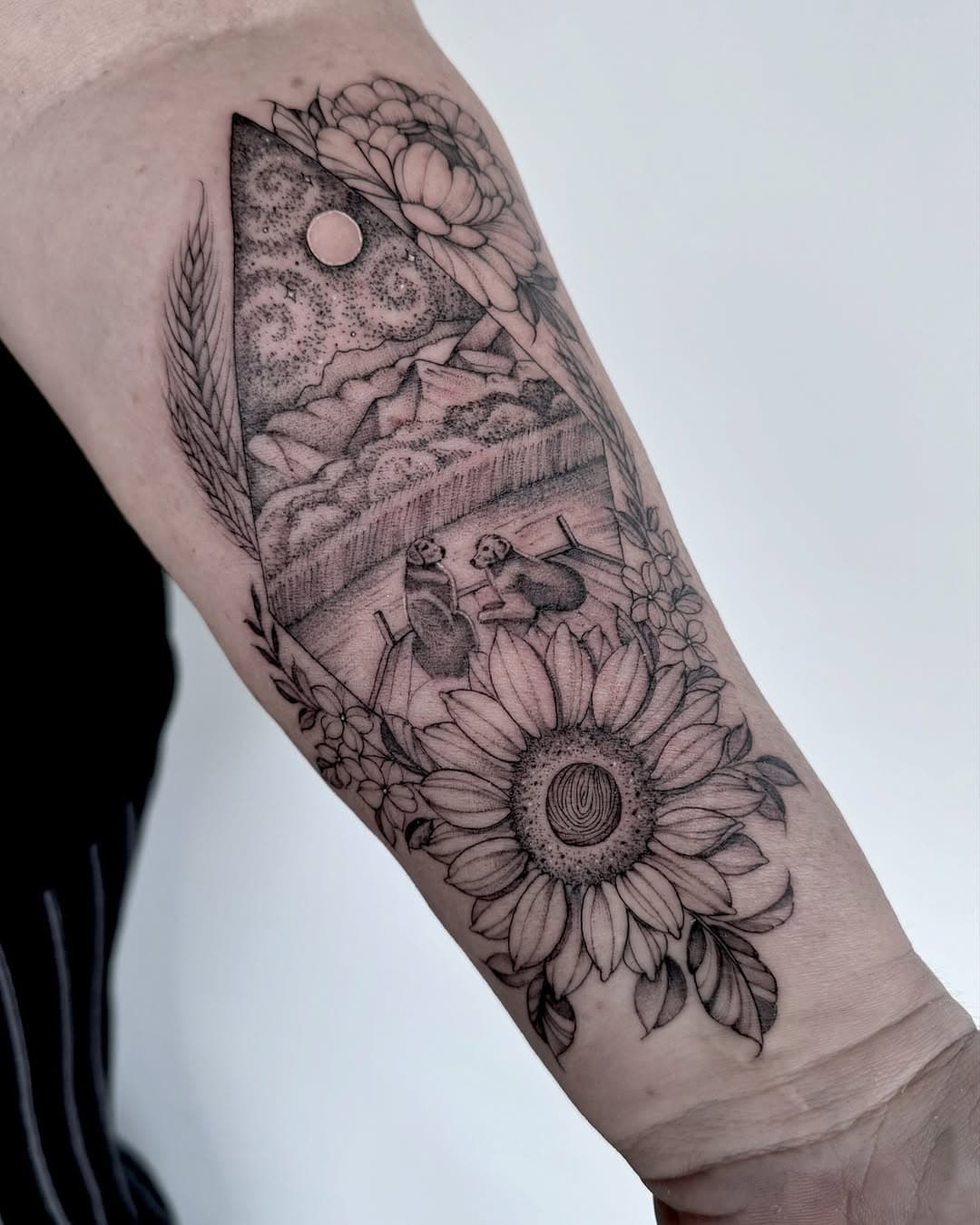 This is one of the most meaningful tattoos I’ve done and I’d love to share why 🖤
Her husband is battling Cancer and he wanted to be able to see this tattoo before he goes to be with Jesus. The center of the sunflower, which was their wedding flower, has his fingerprint, so she can always hold his fingerprint over her heart. The nature scene is the view from their river house which is a special place for them, a few weeks ago they even got baptized together in that river, where she said the water that’s typically cold felt warm in that moment and she came out of the water feeling cleansed. The two golden retriever’s are their babies, they love to sit out on the dock and jump in the water to swim. 

I had tears in my eyes making this design for my client because it is so full of meaning and I feel so thankful that God has put me in a position where I can help people carry a reminder of their loved ones forever. If you’re reading this please take a minute to Pray for her husband Carl 🙏🏻

#sandiegotattoo #sandiegotattooartist #meaningfultattoos #river #riverhouse #rivertattoo #mountaintattoo #nickisnaturetattooclub