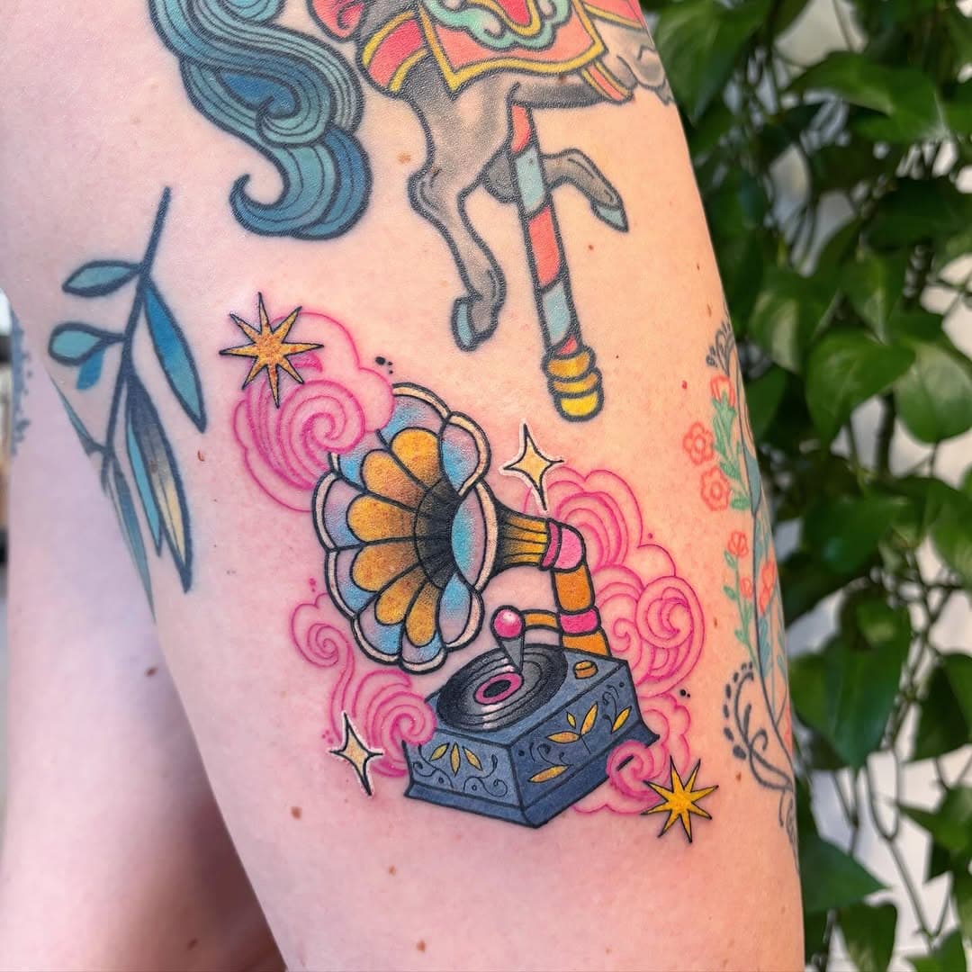 Gramophone for Keira (surrounded by many other tattoos have done over the years too 💖🩵💛)