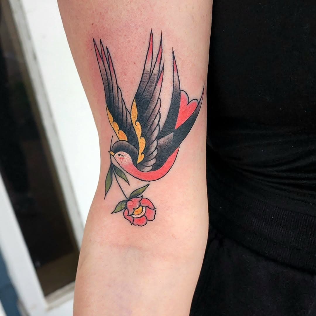 Swallow but make it girly. 
Is it really a Pixie tattoo if there's not a flower in it?
