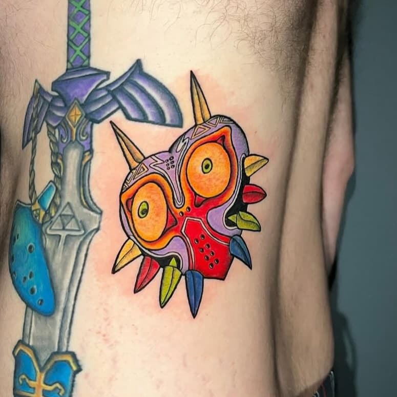 Super colorful Majora’s Mask tattoo by @mikepadula.tattoos! Mike is currently booking the rest of March and April so be sure to hit him up for your next piece #tattoo #nj #newjersey  #njtattooartist #customtattoo #newfoundlandnj #tattoo #okamitattoo #majorasmask #legendofzelda #nintendo