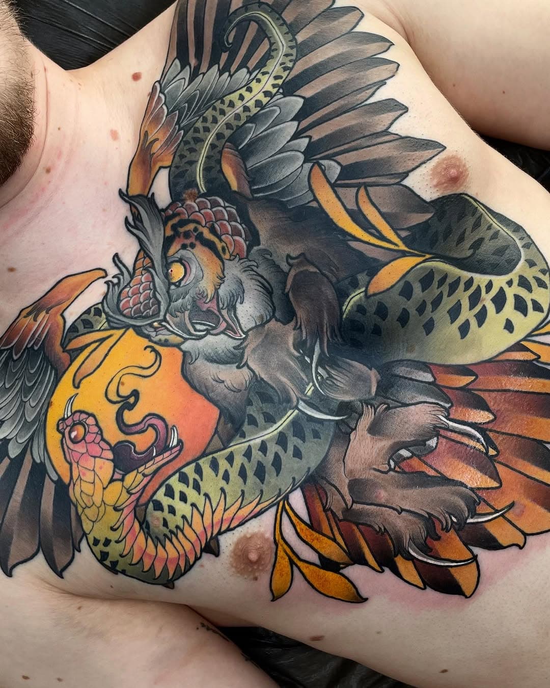 Finally finished this owl&snake chestpiece for Ian. 4 and a half sessions overall. Lower part is fresh, rest healed with no touchups yet. Thanks a lot buddy! …

@neotraditionaltattooers @neotraditionaleurope @neotraditionalworldwide
@tattoosnob @feelfarbig 
@emalla.official 
@balmtattoogermany
#emallaofficial #emallacartridges #tattoosnob #neotradeu #neotradworldwide #neotrad #tradtattoos #neotraditional #neotraditionaltattooers #neotradsub #konstantintattoos #germantattooers #thenewtraditionalistseurope #colortattoo #spektraegdex #fkirons  #TAOT #verlorenejungstaetowierungen #feelfarbig #neotraditionalgermany #neotradger #owltattoo #snaketattoo #chestpiece #chestpiecetattoo